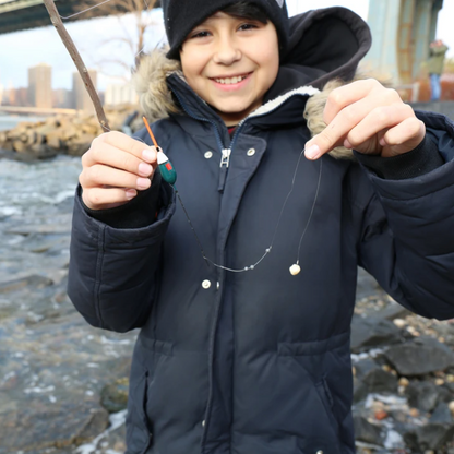 Child holding Fishing Kit