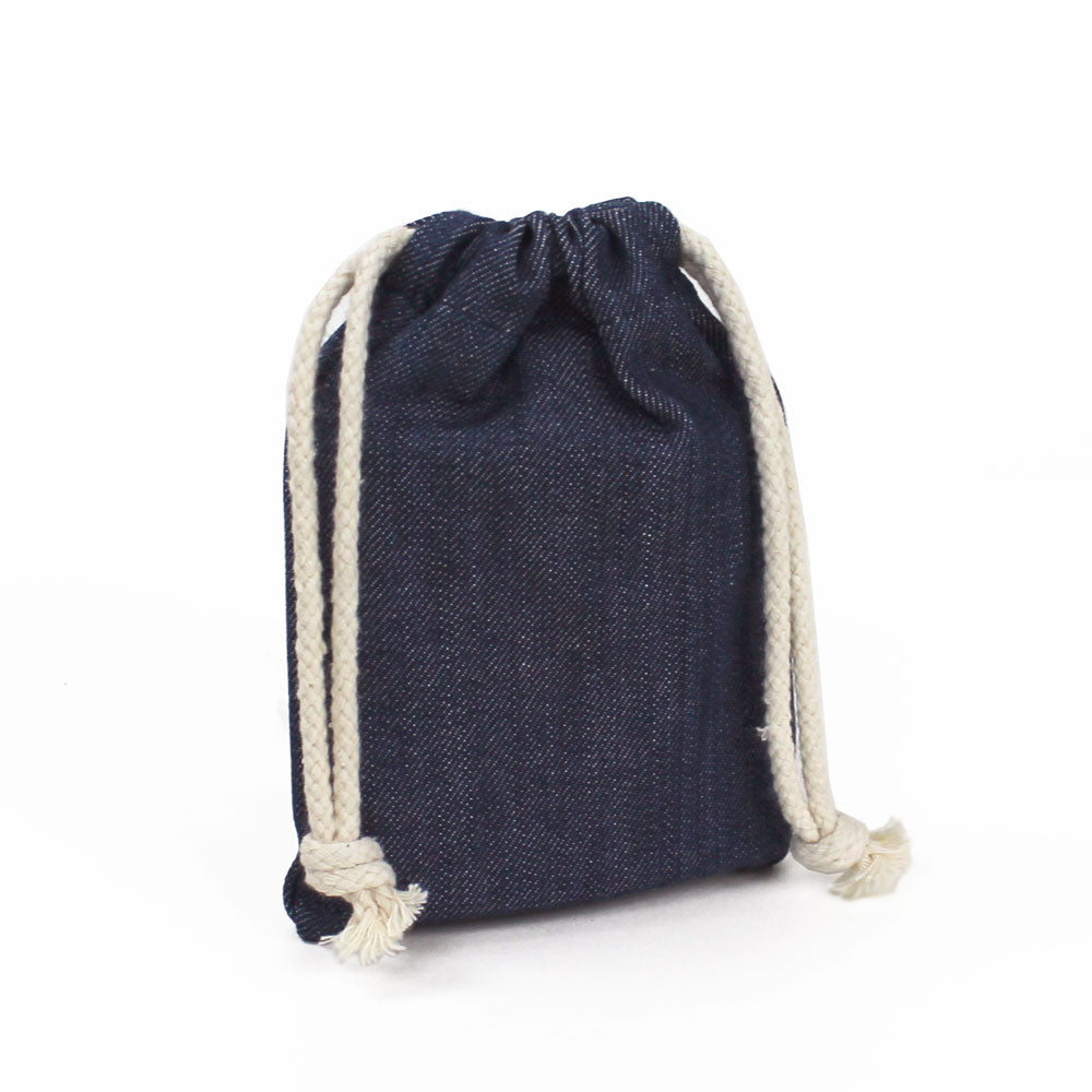 Wooden Flask inside of denim pouch with pouch closed